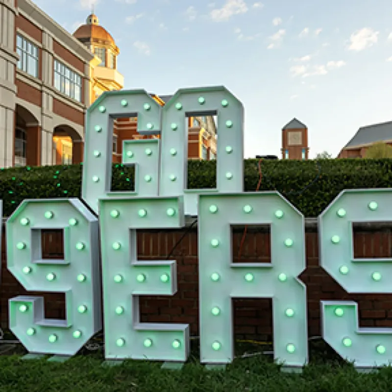 Outdoor pic of campus with Go 49ers marquee